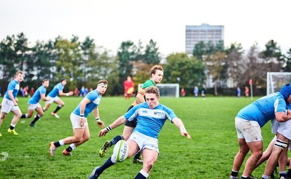 Rugby player kicking a ball